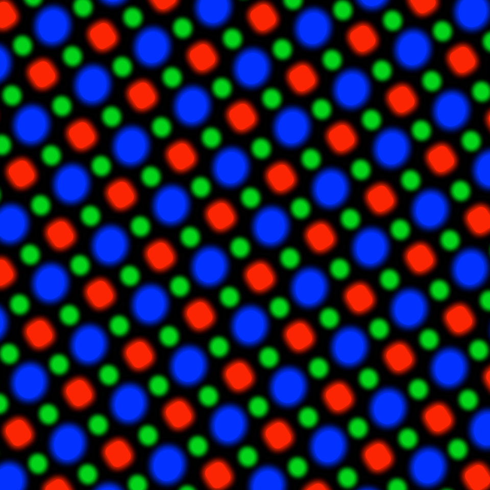 A close-up rendering of an OLED subpixel matrix on a black background: large blue circles and slightly smaller red rounded squares alternating on a diagonal lattice, with small green dots filling the positions between them.